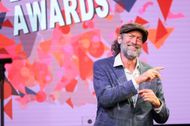 Troy Kotsur signs onstage during the 2023 NAD Breakthrough Awards Gala presented by the National Association of the Deaf at Audrey Irmas Pavilion in Los Angeles, California | Image via: Getty